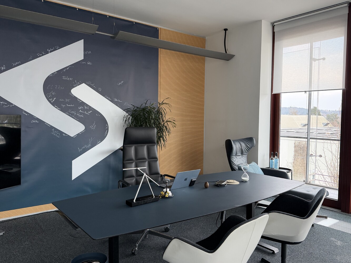 STARK office wall with logo and signatures